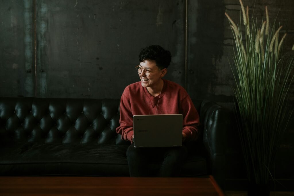 Woman sitting in a chair using a laptop